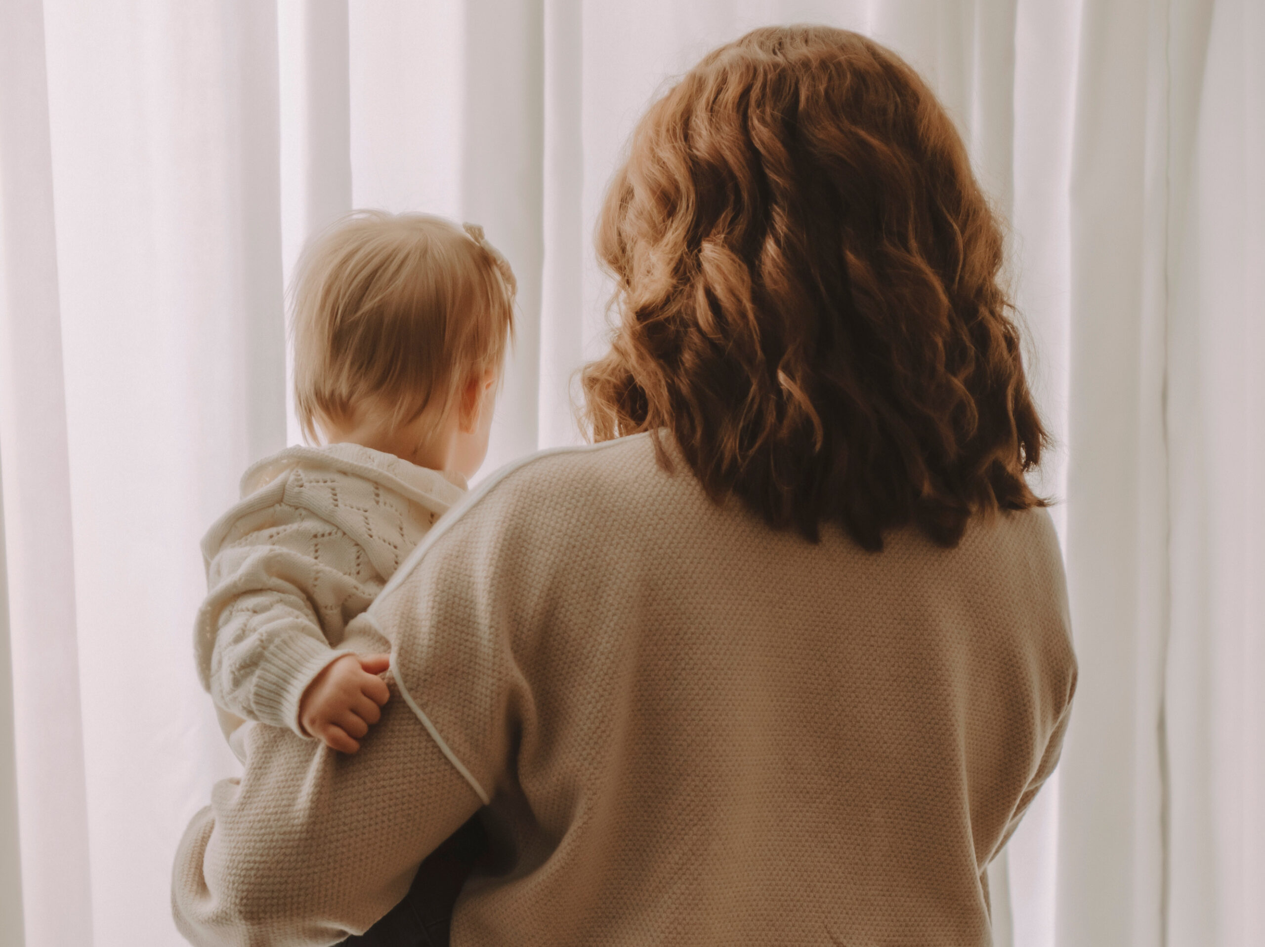 Kait and daughter facing away from camera