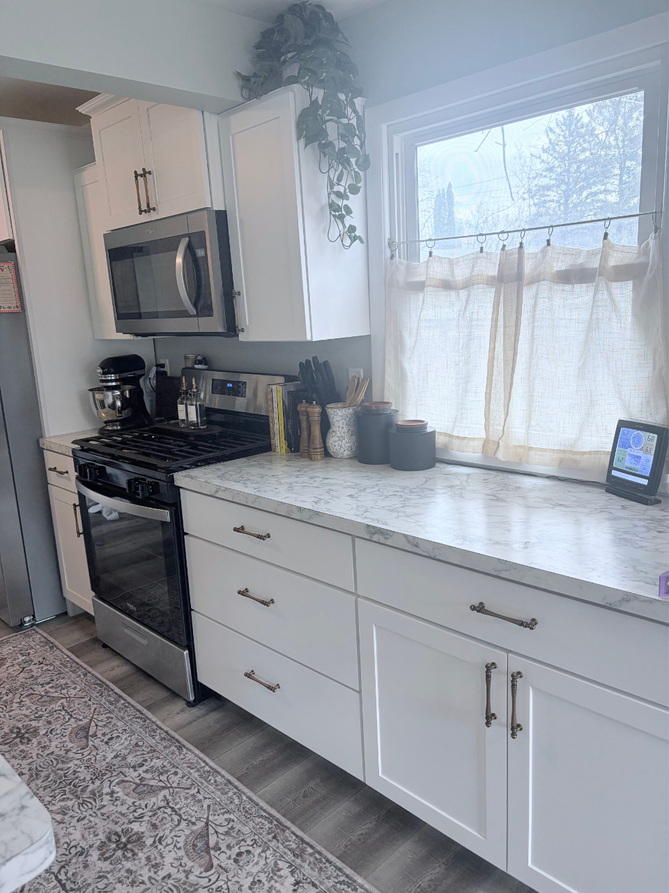 Unfinished kitchen refresh showcasing the closed cafe curtains
