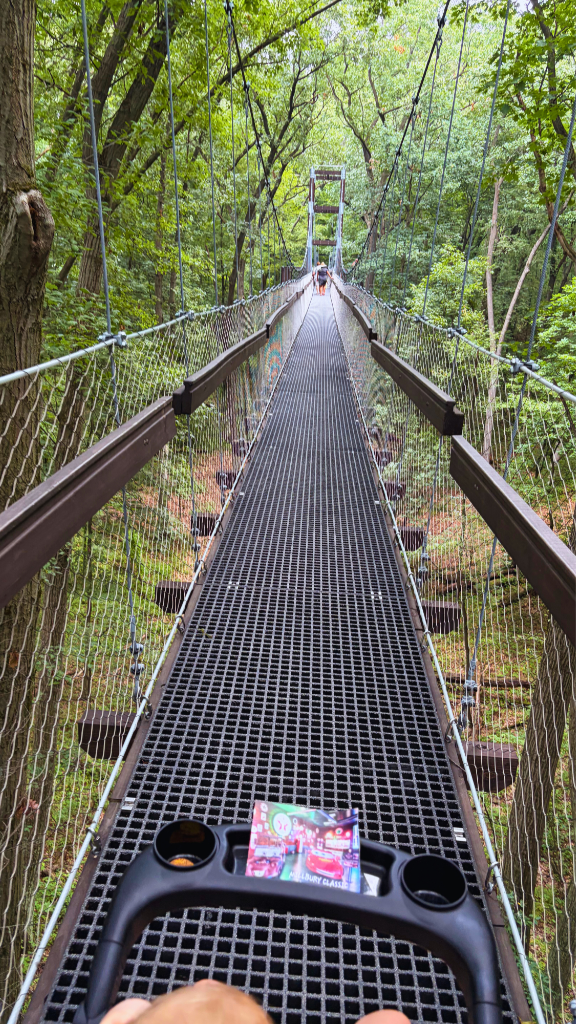 Walking the stroller on the suspension bridge in the Hidden Lake Gardens