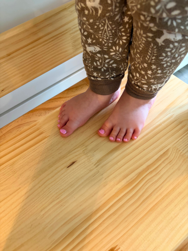 W's toenails painted pink